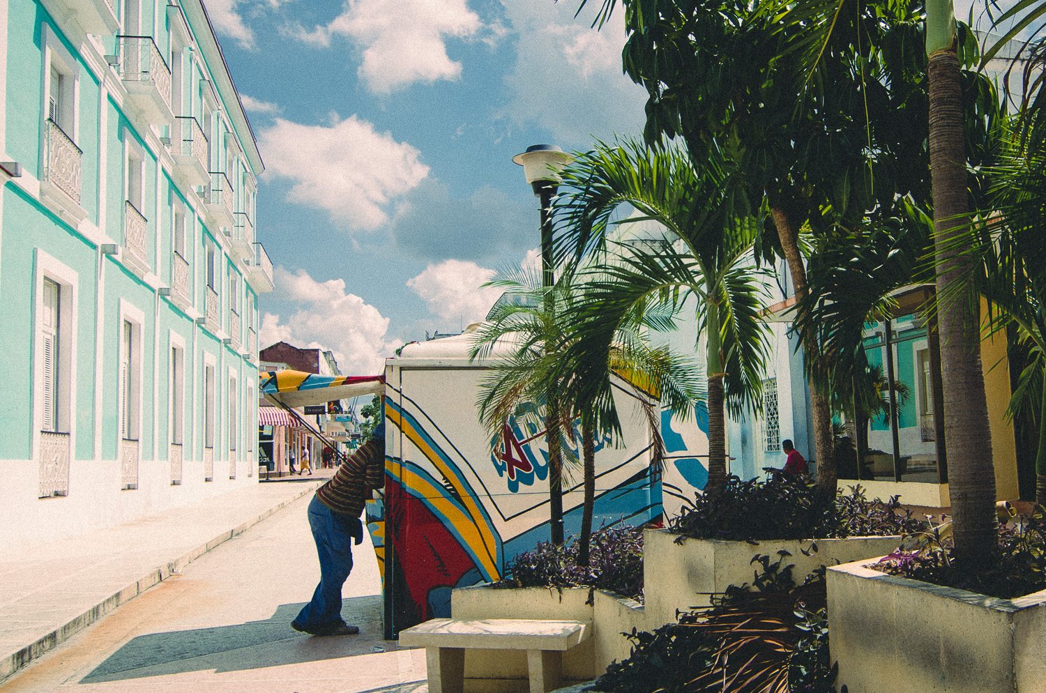 CIenfuegos Cuba Man legs street stall