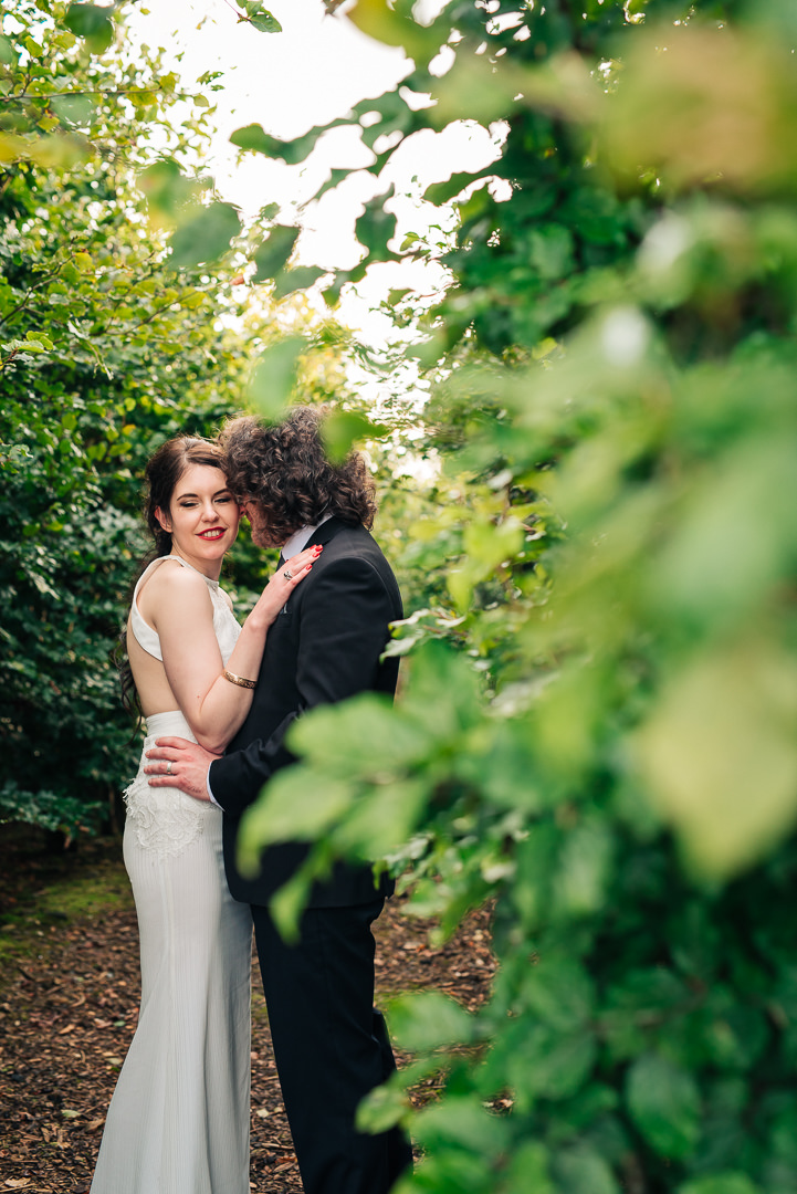 Irish wedding. Bride and Groom. Couple in green leafy area. Reviews of wedding photographer Ireland. Mount Druid Alternative Weddings. 